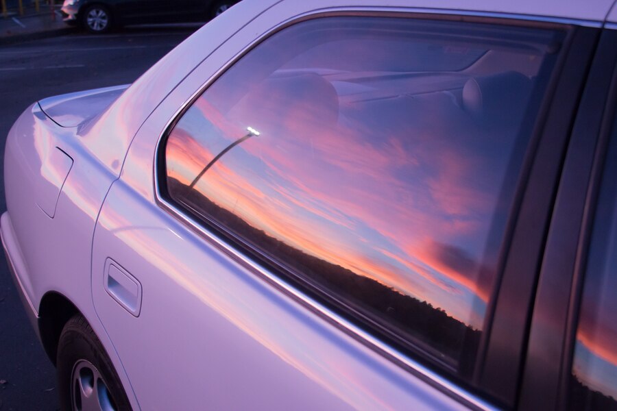 sunset reflection on purple car