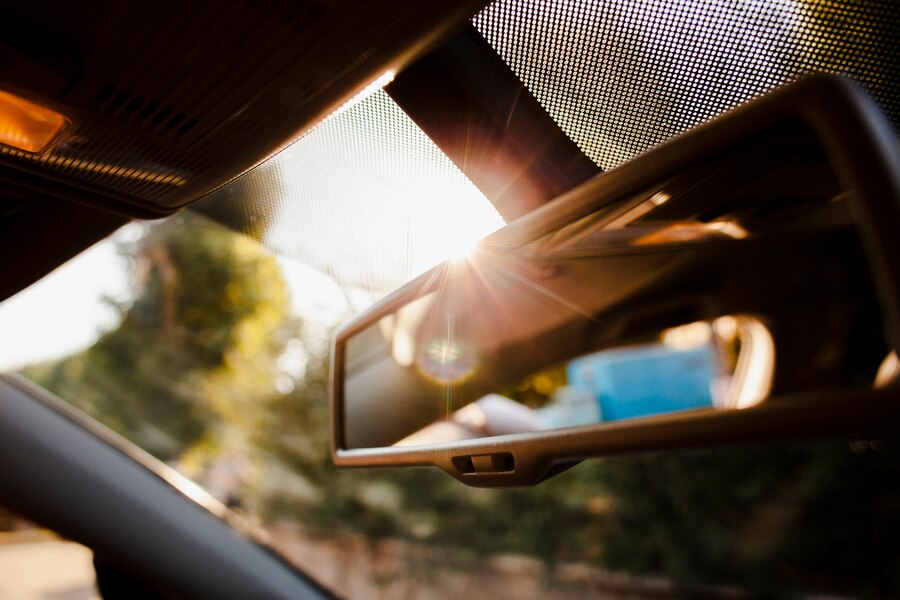 Close-up rearview mirror in sunshine