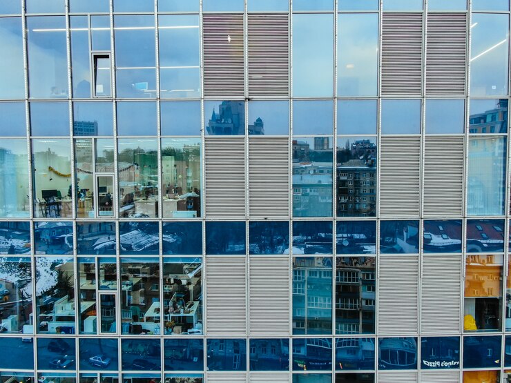 street-reflection-glass-steel-building-facade_1153-4568